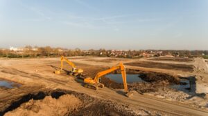 high angle shot two excavators building site