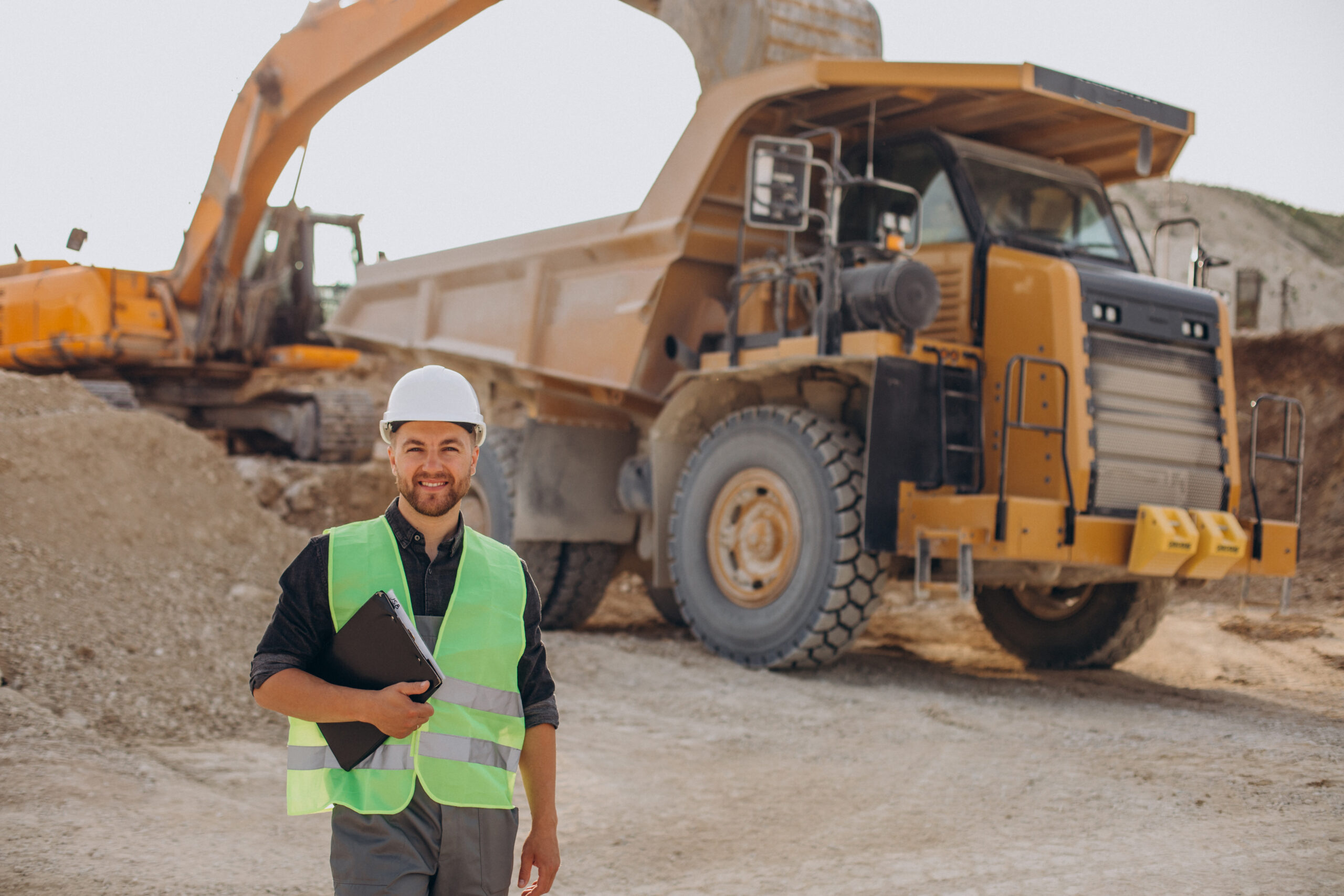 Male worker with bulldozer in sand quarry Confira as mais de 50 vagas de emprego abertas. Oportunidades para diferentes áreas, incluindo mineração e construção, com benefícios atrativos e programas de inclusão